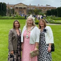 Kirsty Richardson, Karen Douglas Mayor of Ards and North Down, and Janine Caldwell in front of Hillsborough Castle at the Royal Garden Party